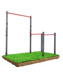 Outdoor pull-up and dip station with two red training bars on grass – durable garden fitness equipment